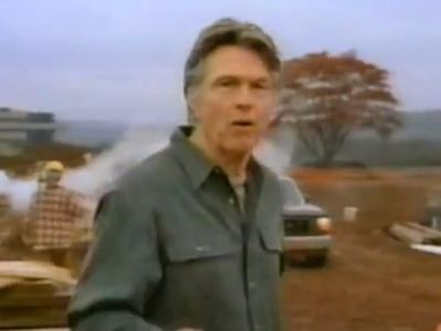 Tom Skeritt is in a construction site talking to the camera.